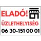 Eladó üzlethelyiség tábla telefonszámmal