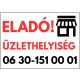 Eladó üzlethelyiség tábla telefonszámmal és grafikával